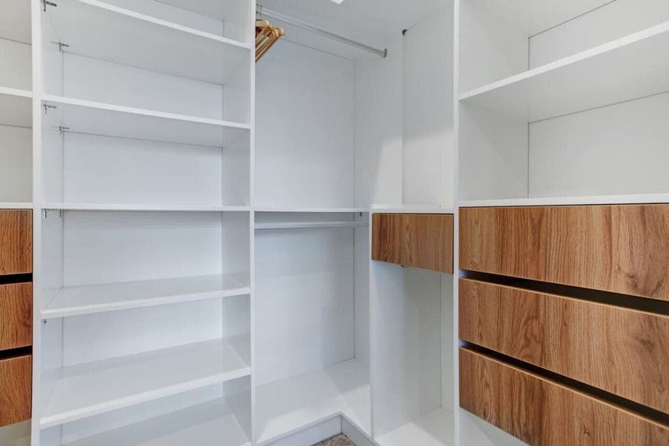There is plenty of storage in the walk-in wardrobe for all your personal belongings.