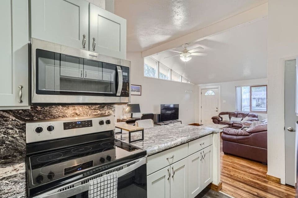 The open floor plan allows for enjoying your favorite movie or show while preparing your favorite meal