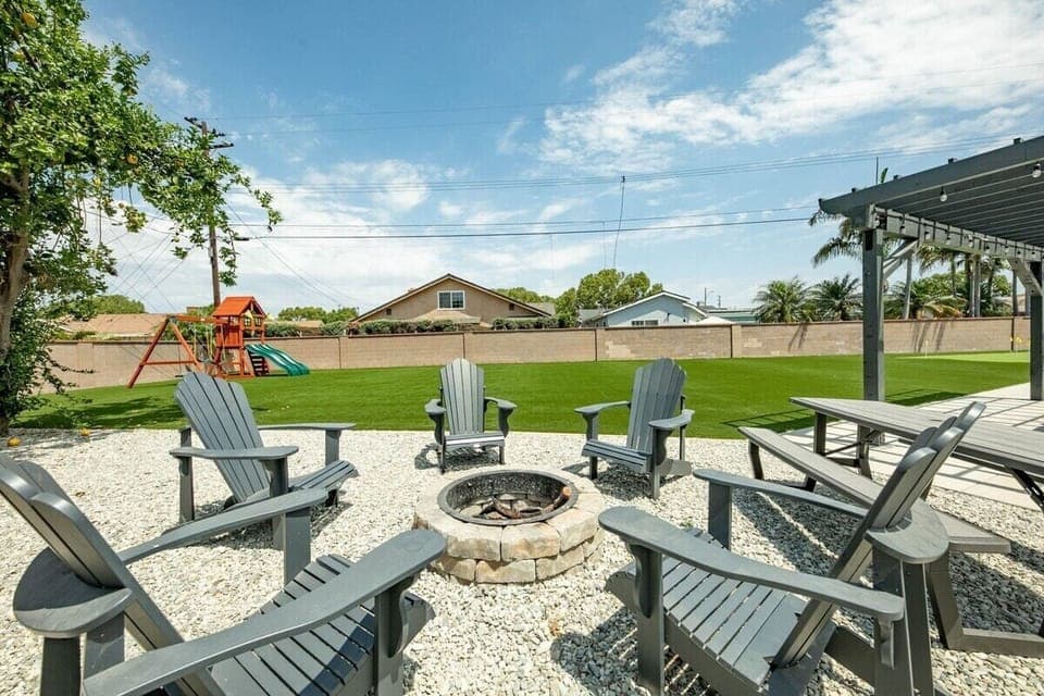 Inviting outdoor space featuring a cozy fireplace, perfect for evenings spent under the stars. 