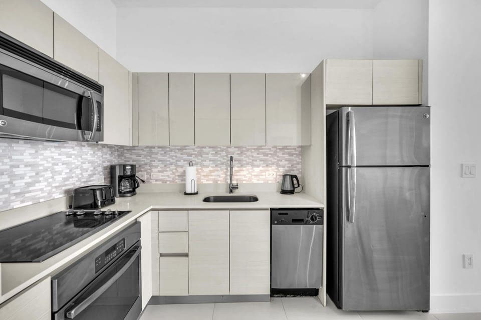 Cook with ease in the full kitchen, complete with essential appliances, cookware, and ample space.