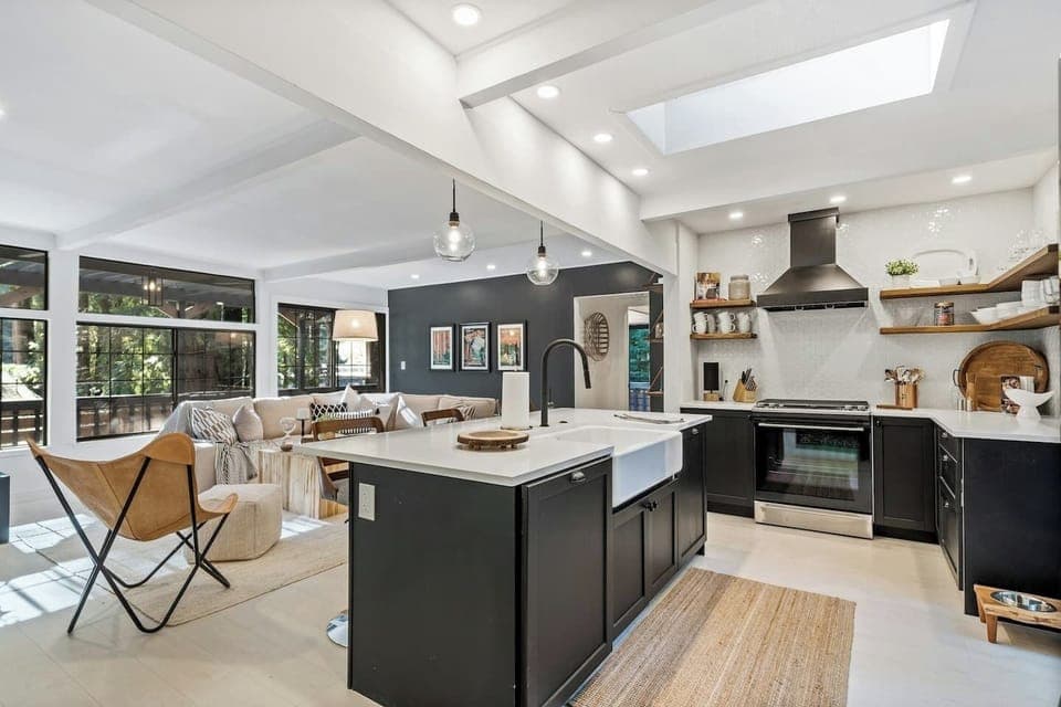  The open kitchen invites conversation with bar seating and plenty of space to make meals. 