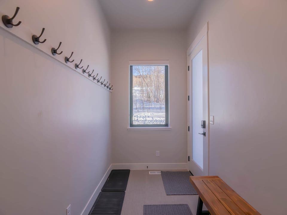 Ski valet with scenic aspen tree views.