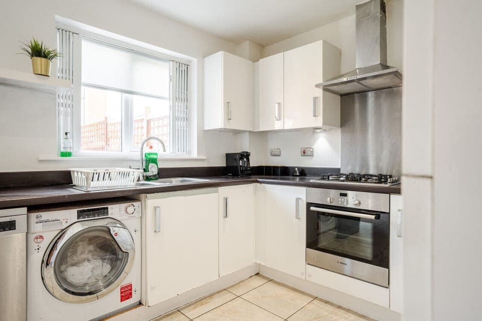 Kitchen. Fully equipped with cooking equipment perfect for families. Appliances such as fridge freezer, microwave, cooker, oven, dishwasher Toaster are free and available for your use.
