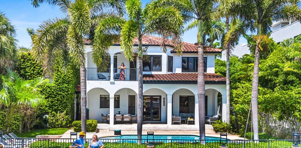 Relish in the scenic waterfront tranquility of this Mediterranean-style villa, nestled on a serene isle between the picturesque Las Olas Boulevard and the vibrant New River.