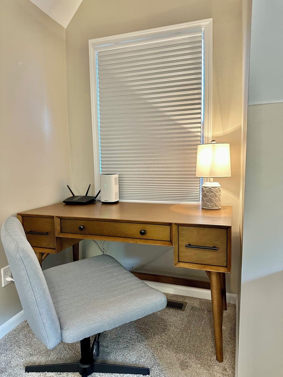 Designated workspace in upstairs bedroom offers a desk and comfortable chair.