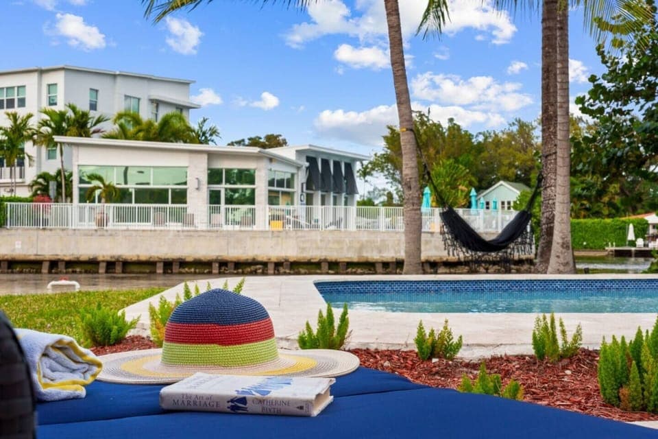 Enjoy a peaceful view across the waterfront, where the charming neighbor’s home adds to the serene and picturesque surroundings.