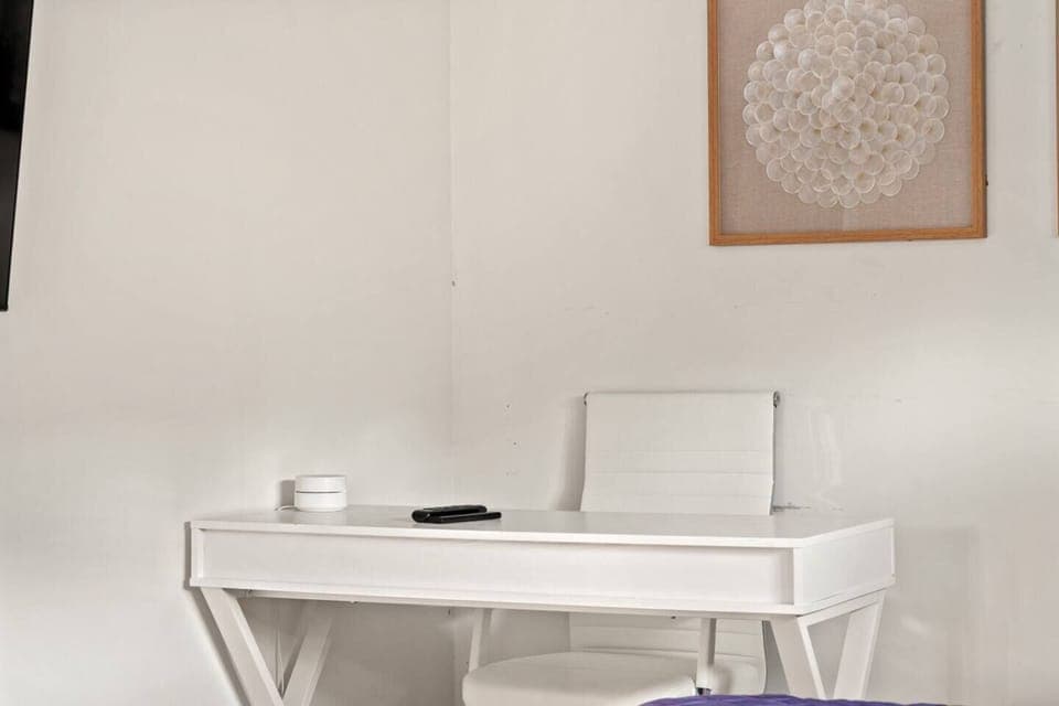 Set up for work or leisure at this sleek and functional desk, providing a comfortable space for productivity or planning your next adventure.