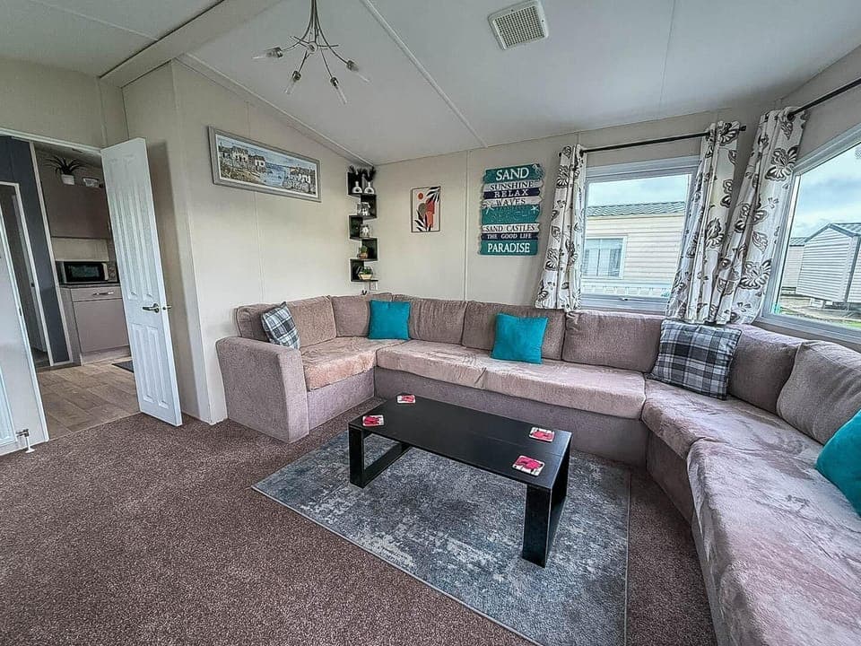 Spacious living room with cozy sectional and ocean views