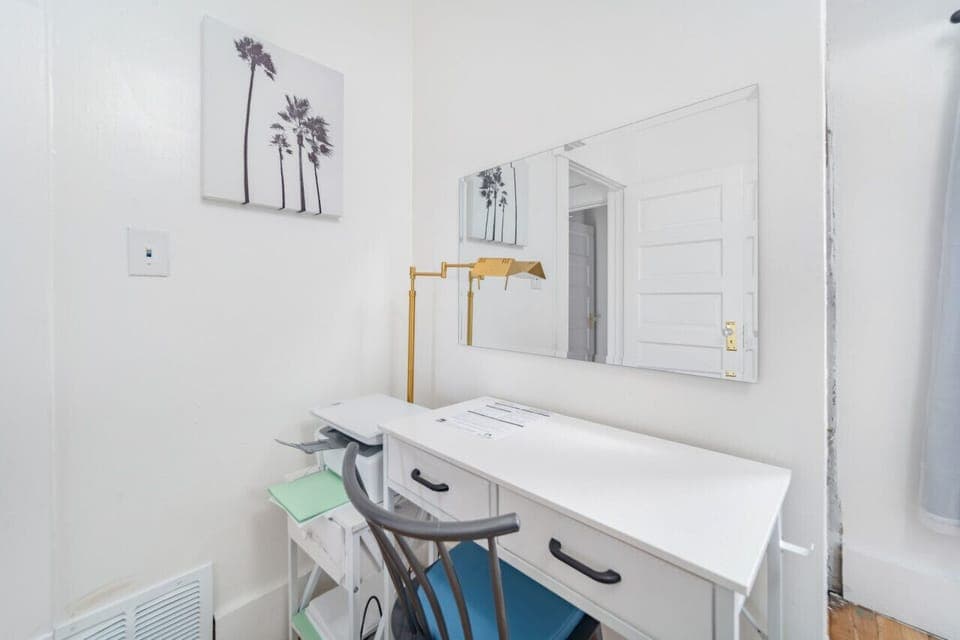 The third bedroom has a small office area