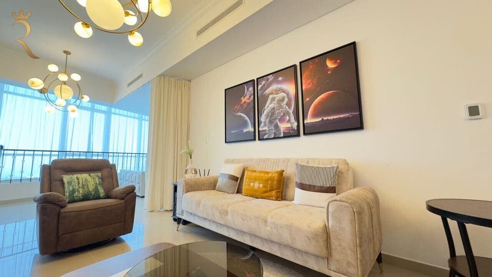 Relax in Style: Cozy up in this spacious living room, designed for comfort and modern elegance. Perfect for unwinding after a day of exploring.