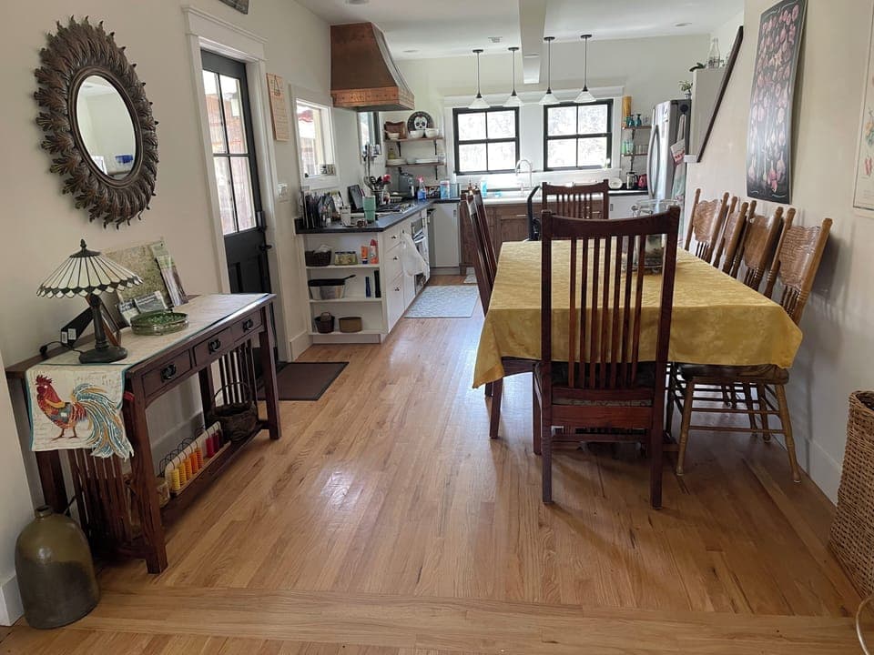 Dining area into kitchen. Seats 8, can add extra leaf to seat 12.