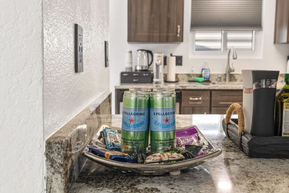 Coffee & cocktail station w/ granite counters, stocked essentials, and a cozy spot to start or end the day.