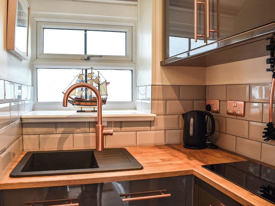 Kitchen area | White Mermaid - White Cottages, Newborough 