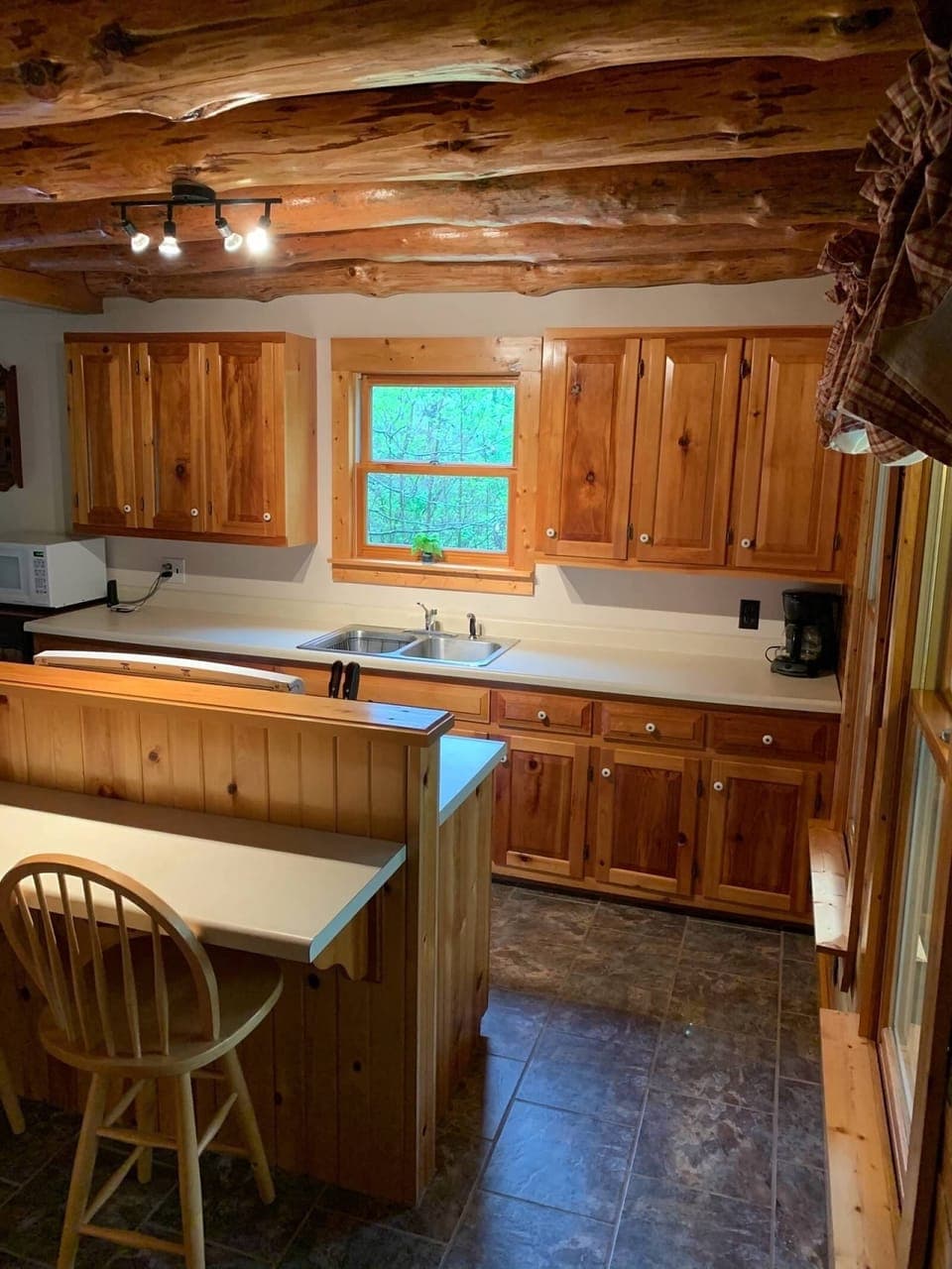 Kitchen with Gas Stove, Coffee Pot, Dishwasher, and Microwave
