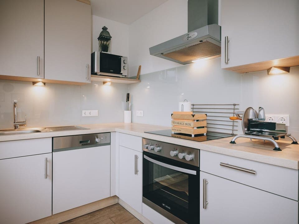 Kitchen in the holiday apartment by we rent apartments, with a stove, oven, and fully equipped.