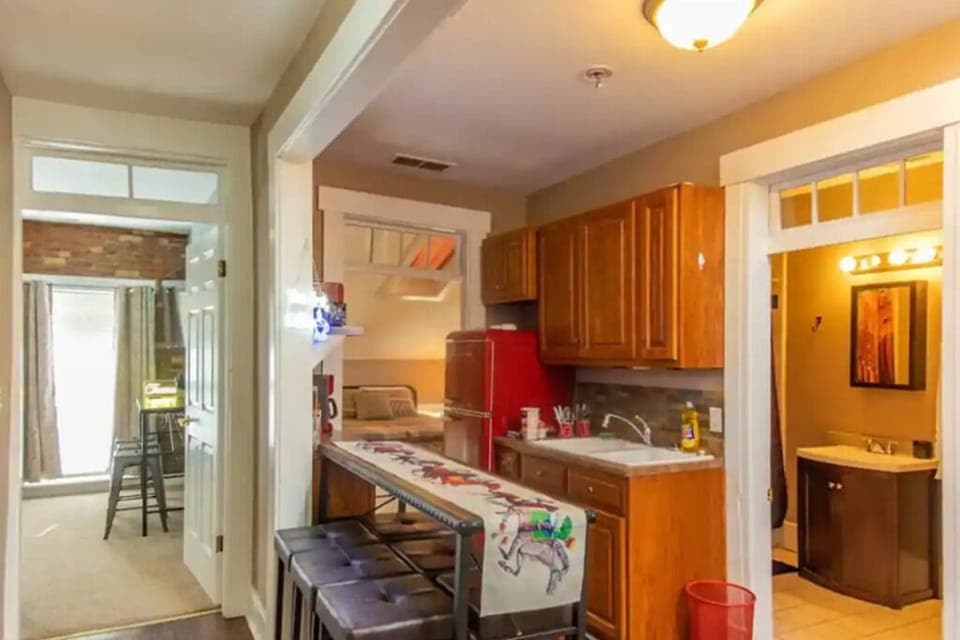 Secondary kitchen with additional fridge and stove.