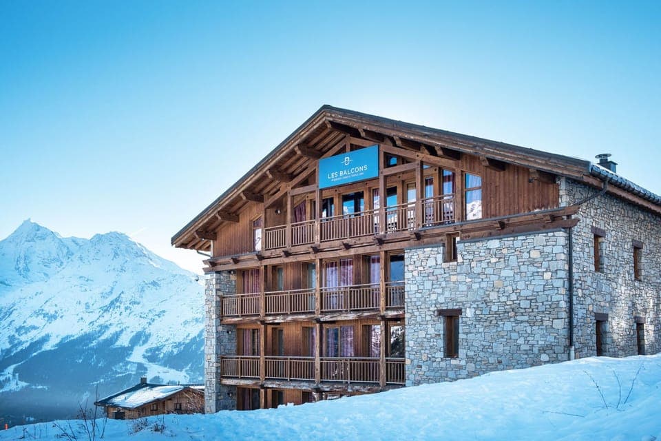 This alpine retreat offers a serene escape with stunning mountain views, perfect for a winter getaway.
