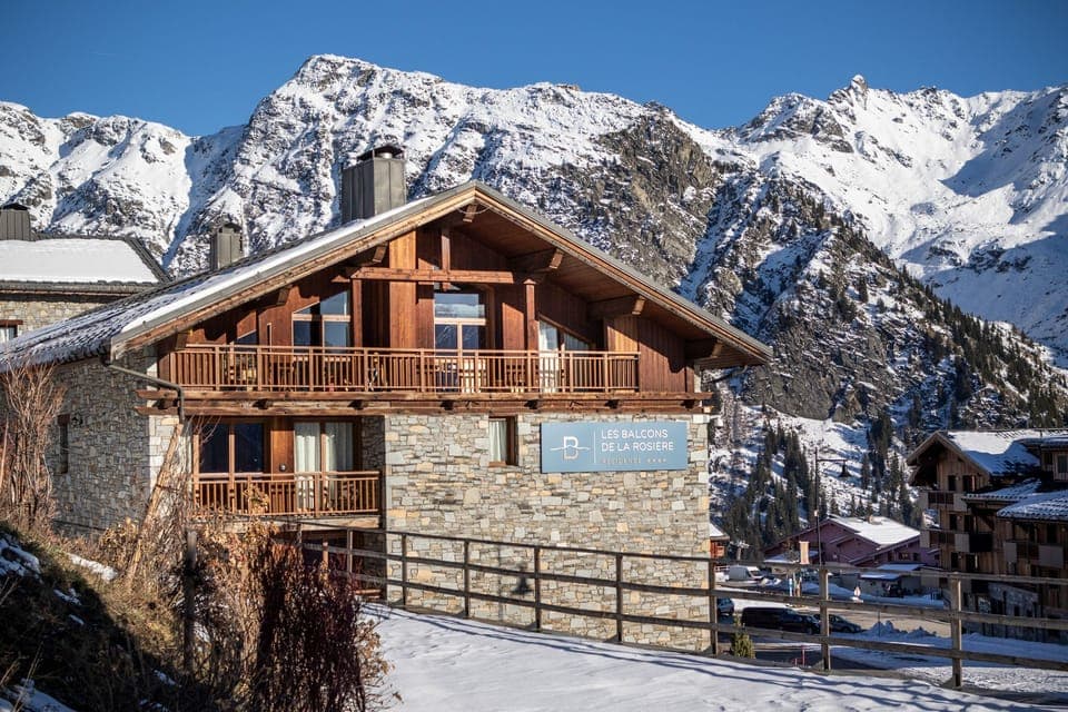 Experience the warmth of this rustic chalet, set against a backdrop of crisp winter landscapes, ideal for a cozy mountain retreat.