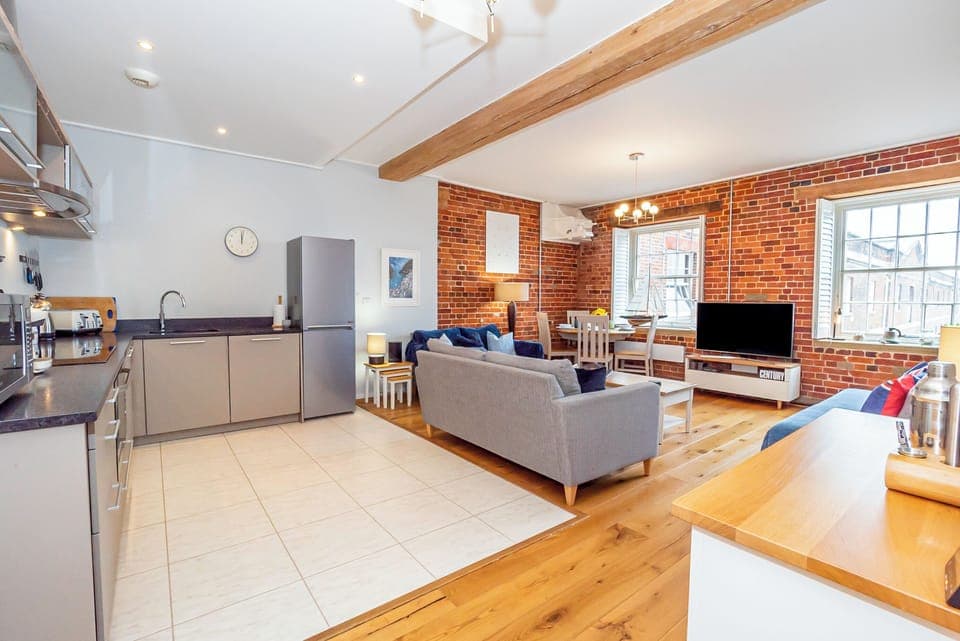  Step into your stylish, open plan living room and kitchen area- with beautiful hardwood floors and stunning views