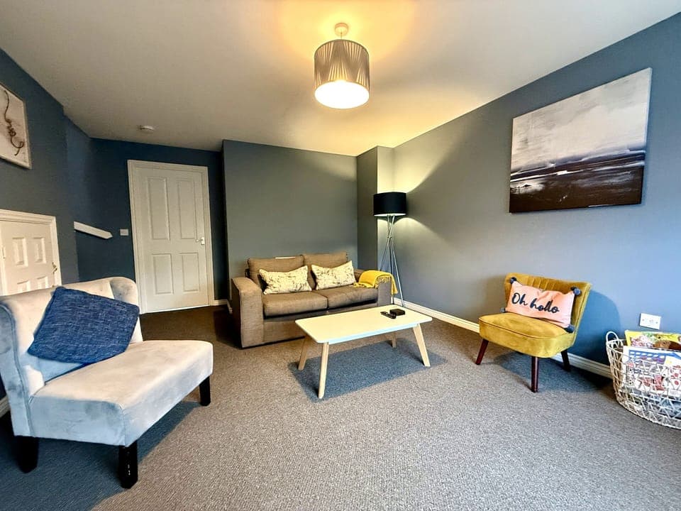 Living Room: Bright and inviting space with stylish seating and cheerful decor awaits you!