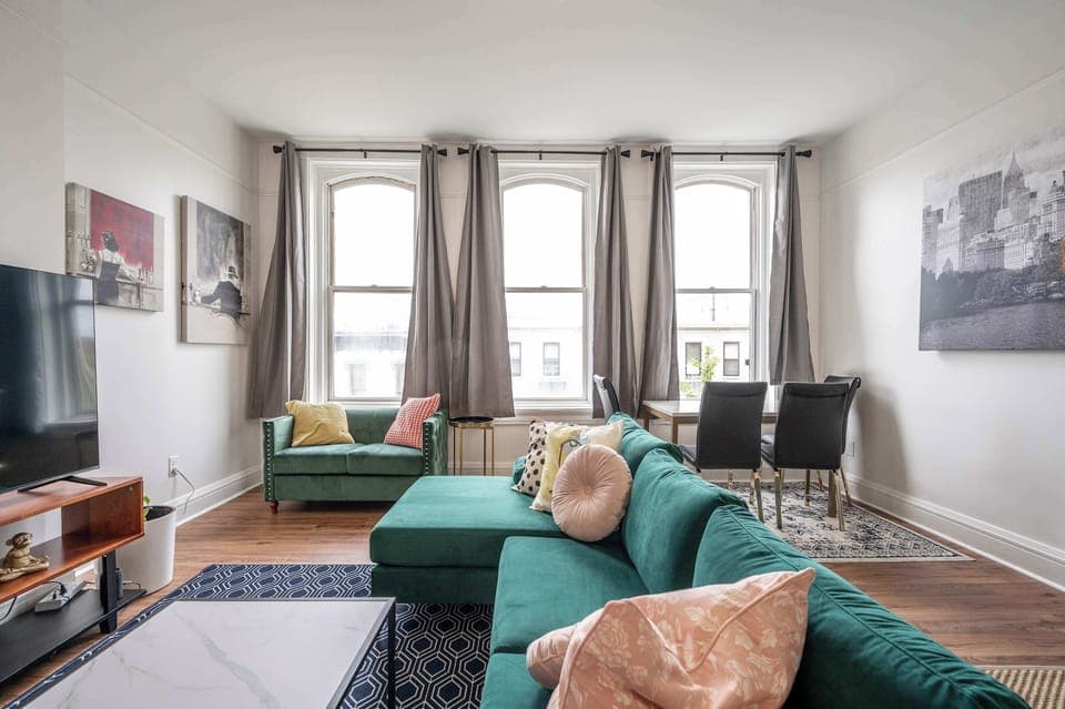 Cozy and spacious living area with TV