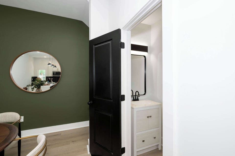 A convenient half bathroom is available on the main level