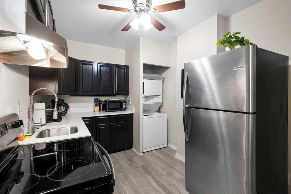 The sleek kitchen offers loads of storage space & every home comfort