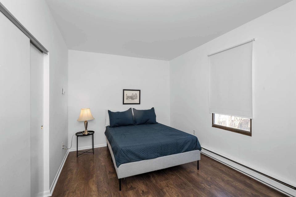 Suite 1: The serene bedroom retreat features a plush queen-sized bed