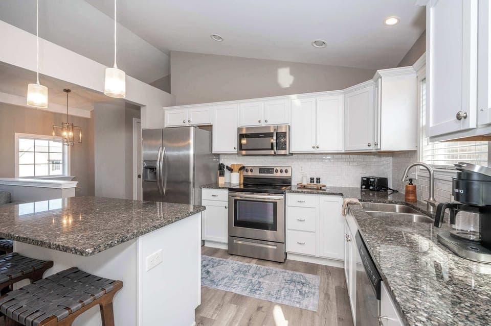 The open, airy kitchen offers loads of space & all the comforts of home