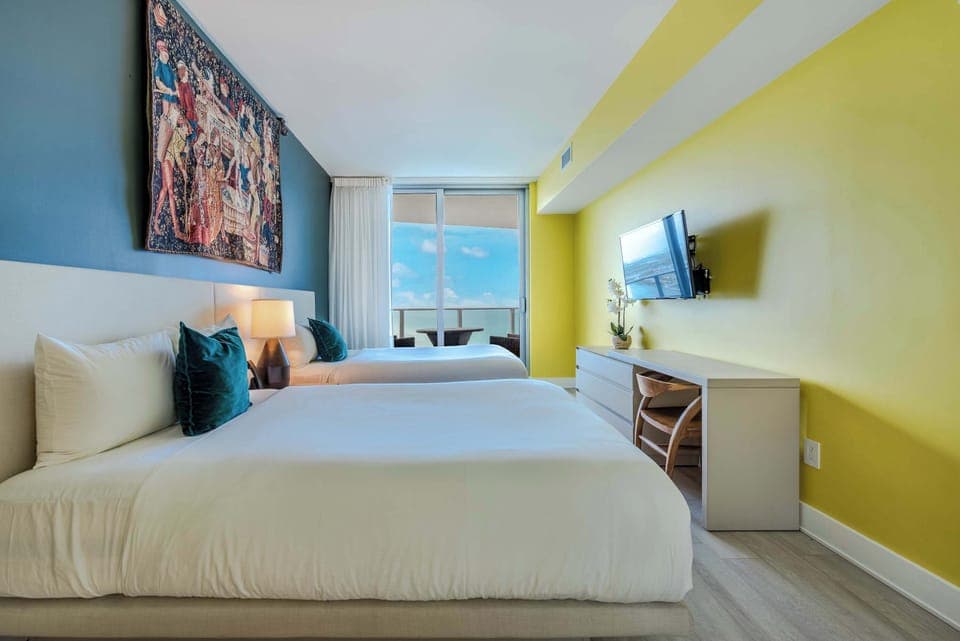 Bedroom 2 with 2 Queen beds, and TV