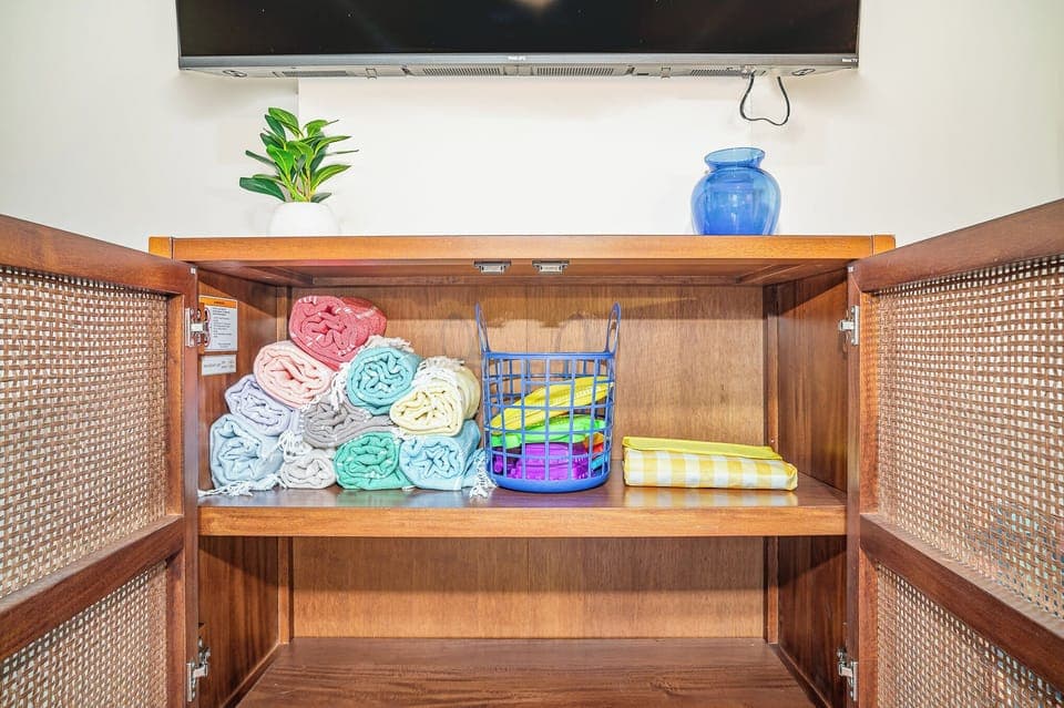 All your beach essentials stored inside this enclosed cabinet underneath the TV
