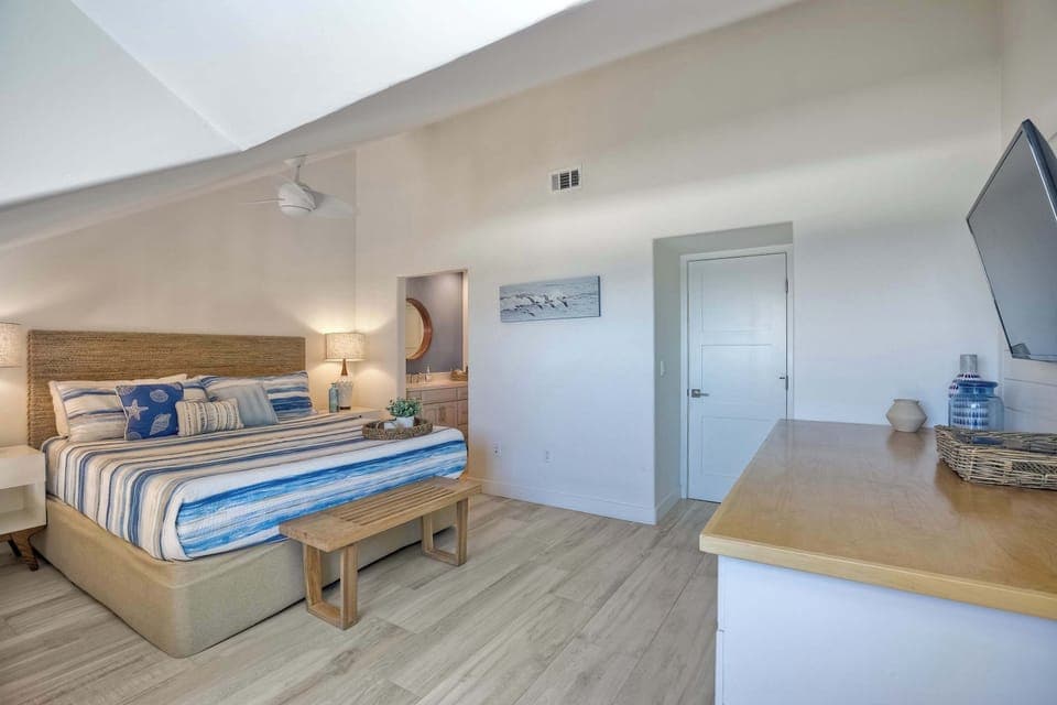 Bedroom 3 with King bed, desk, and private en-suite