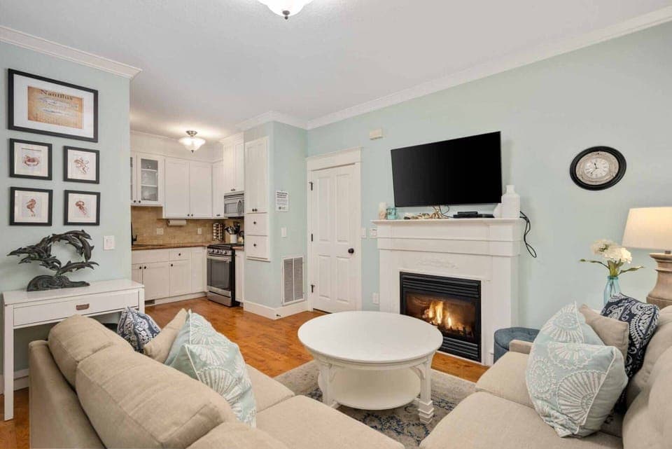 The cozy living room offers a big screen TV and gas fireplace for those chilly nights.