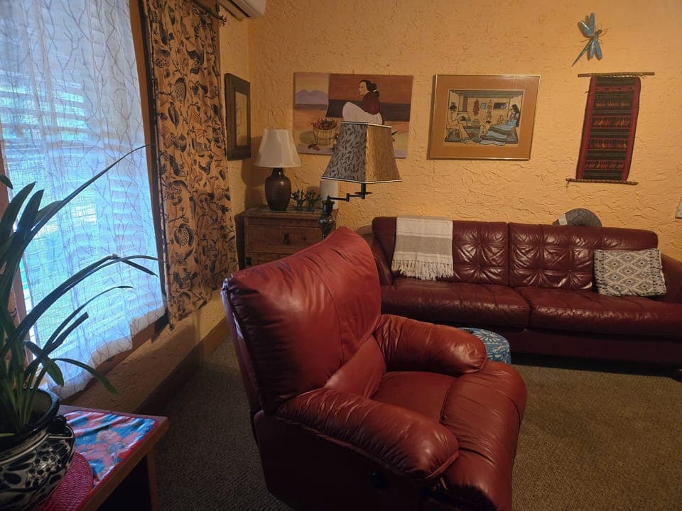 Living room with comfortable recliner & sofa

