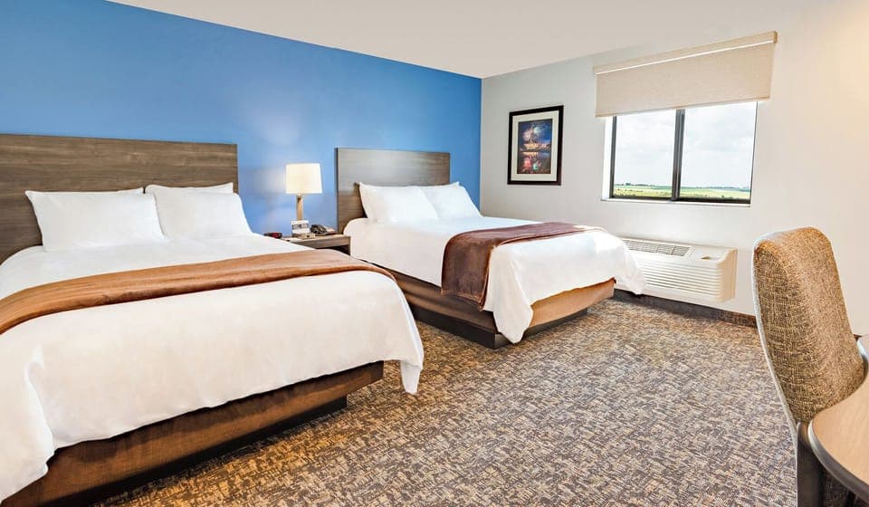 Settle into two plush beds with airy daylight views.