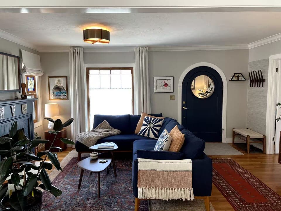 Living room as viewed from the dining room. The rounded door is our front door.