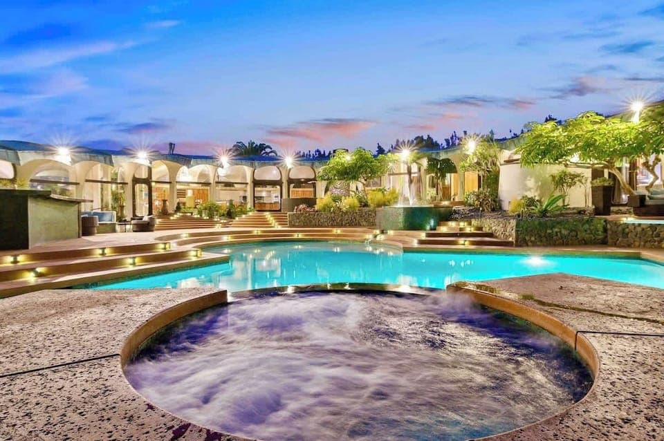 A private resort with all the amenities all to yourself! This expansive 1.5 acre estate comes with a massive heated pool , spa, mini golf, full court basketball,  tennis court, and large game room. The perfect retreat for endless fun for your group!