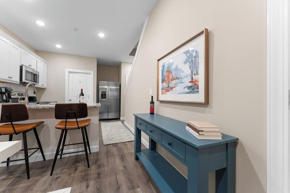 Chic bar stools and decor make this kitchen nook cozy and inviting.