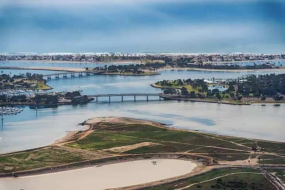 Take in the magnificent aerial view of Mission Bay in San Diego, a captivating haven for water enthusiasts.  This aquatic playground beckons you to embark on thrilling adventures, from jetskiing and sailing to boating and wakeboarding