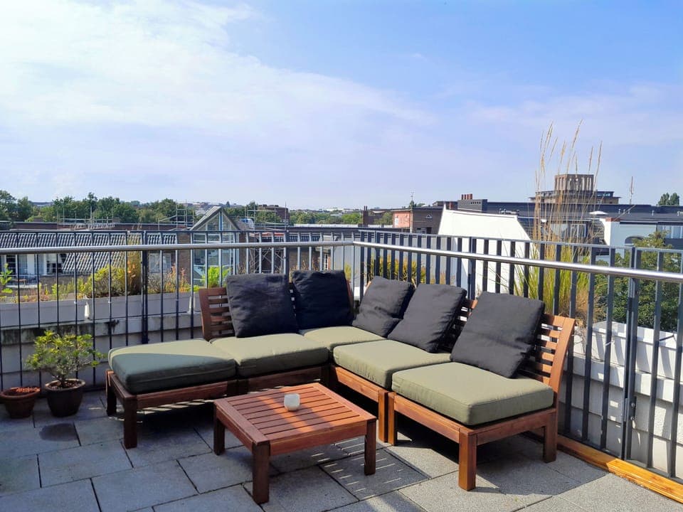 Arrange the seating and lounging area on the rooftop terrace as you like.