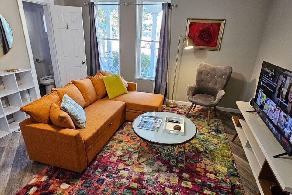 Comfortable living room with pull-out couch and 50in streaming TV