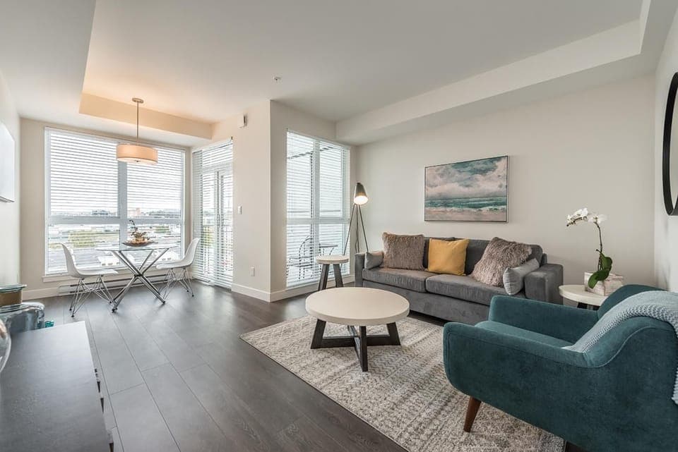 Bright living room with cozy seating and city views