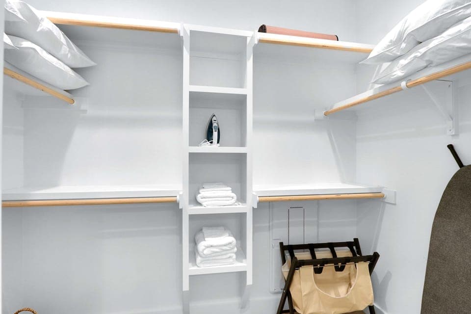 Keep clothes & bags tucked away in the master walk-in closet