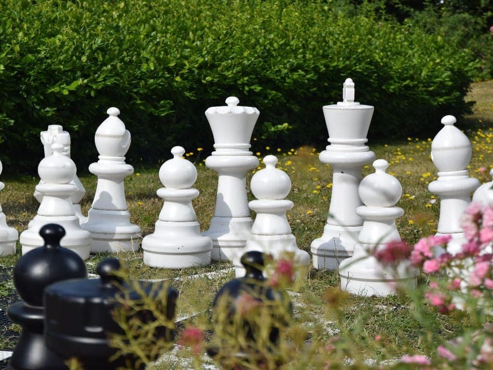 Challenge friends or family to a game of life-sized chess in the garden, creating unforgettable moments in this charming outdoor setting.