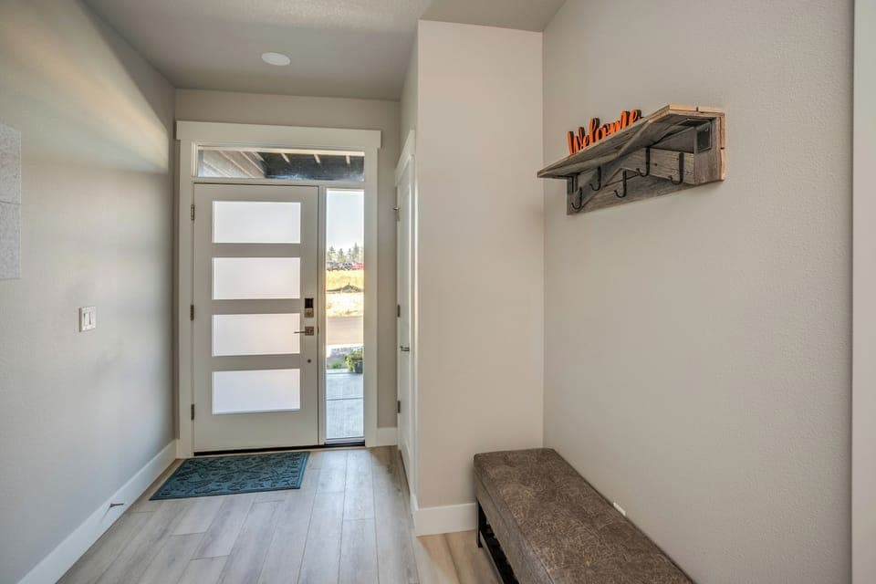 The front door from inside the home leads to the HOT TUB and patio.