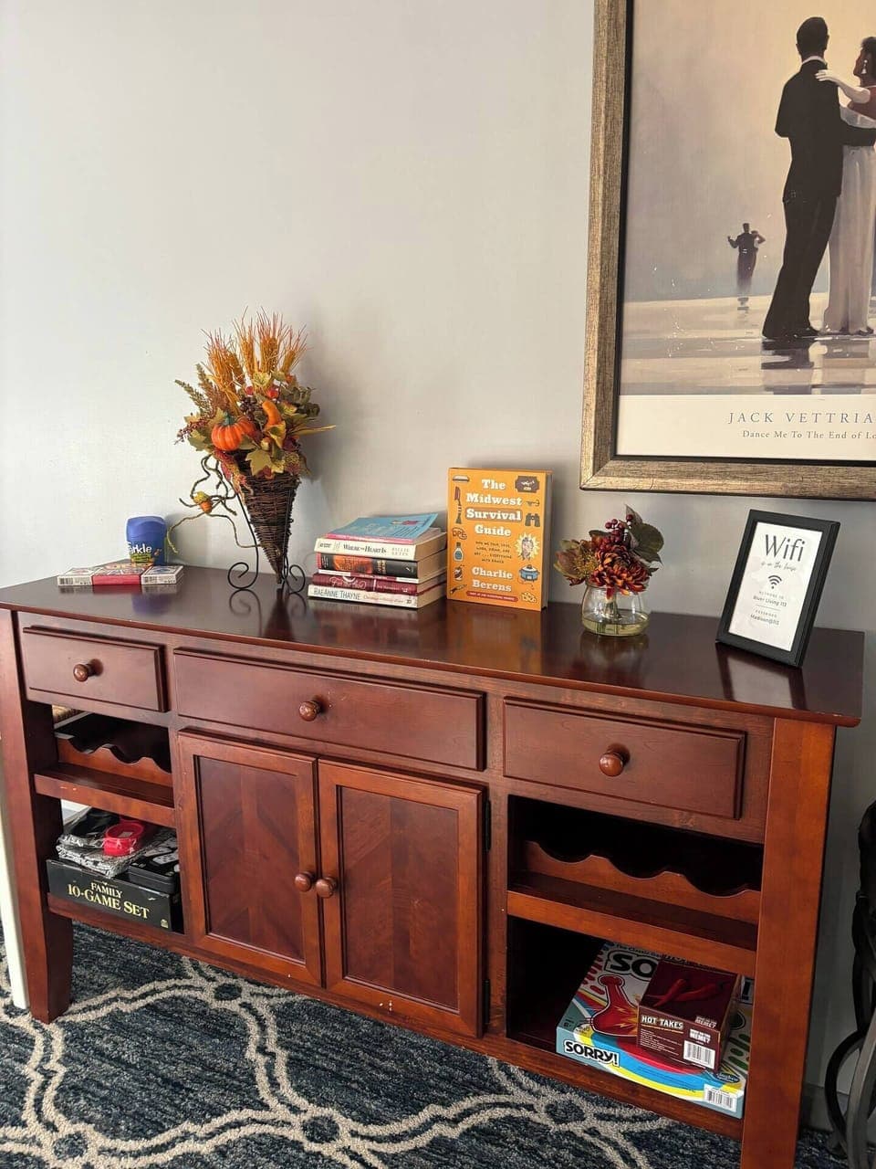 Living Room hutch stocked with board games and books