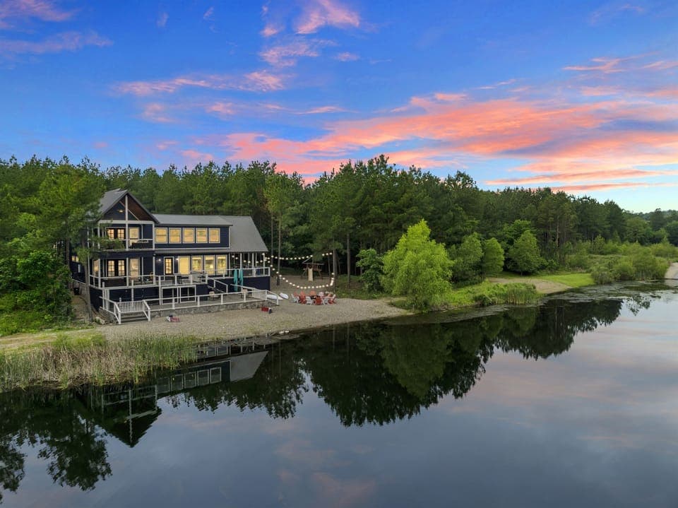 Nestled by a tranquil pond and framed by lush trees, this cabin is your perfect nature escape.