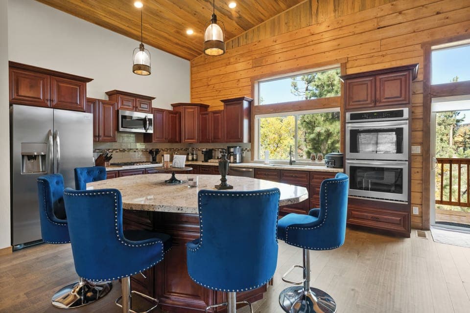 The large kitchen island offers a place to hang-out and extra seats for dining. 