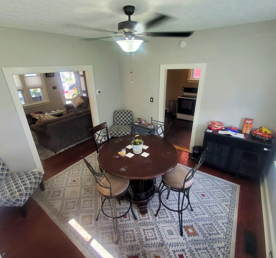 High-Top Table & Chairs, Games, Hardwood Floors, Rug and Room-Darkening Blinds