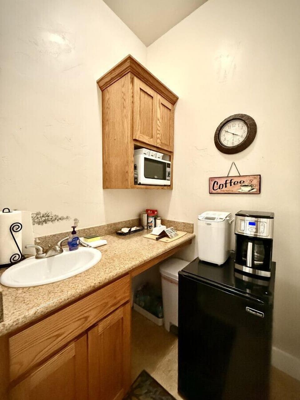 Kitchenette stocked with the essentials:  sink, microwave, refrigerator and coffee maker